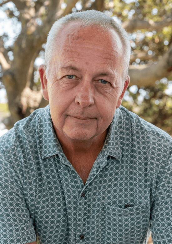 Blair Chinnery, outdoors at park leaning on a handrail